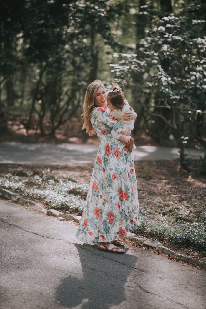 This blogger is 27 weeks with baby number three! Come check out her easy maternity style in this floral maxi dress!